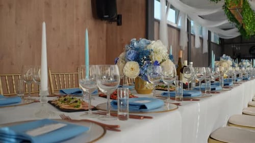 shot of luxury dining-table for an wedding occasion in the indoor restaurant area with a garden view