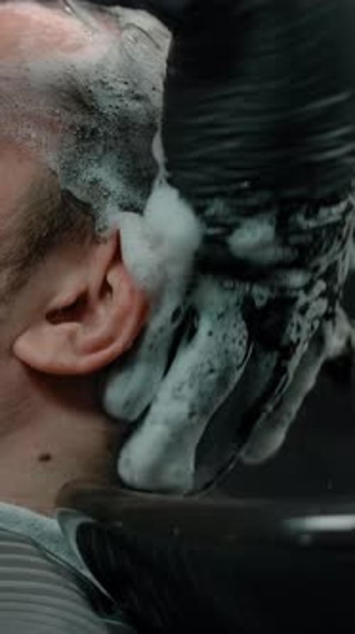 Man Getting Shampooed at Barber Shop, Close Up