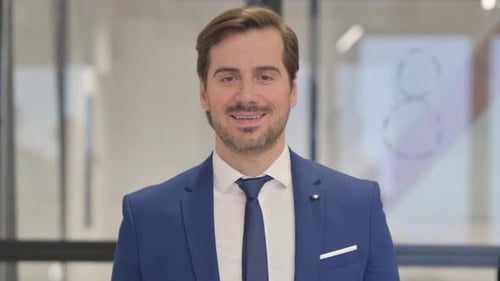 Confident Man Talking in a Corporate Setting