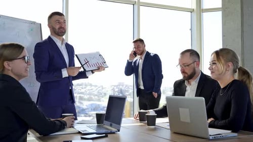 Positive business people in office. Team of entrepreneurs collaborating together.