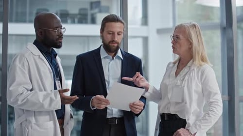 Entrepreneur Discussing Strategy of Clinic Growth with Doctors