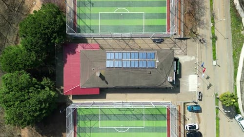 Empty green soccer field top-down drone shot