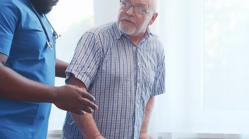 Old Man Patient in a Nursing Home Assistance Rehabilitation and Health Care Concept