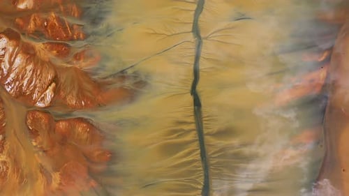 Aerial view of colorful natural water patterns. Mining water pollution, environmental pollution