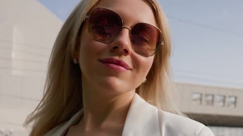 Stylish Woman in Sunglasses Walking in City