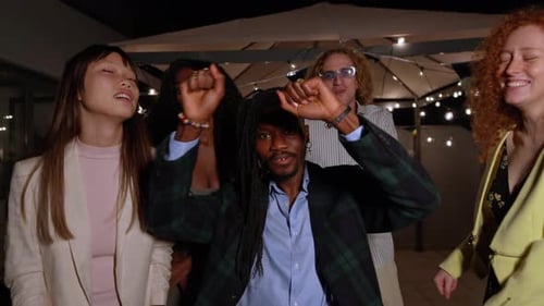 Friends Dancing Together at an Outdoor Party