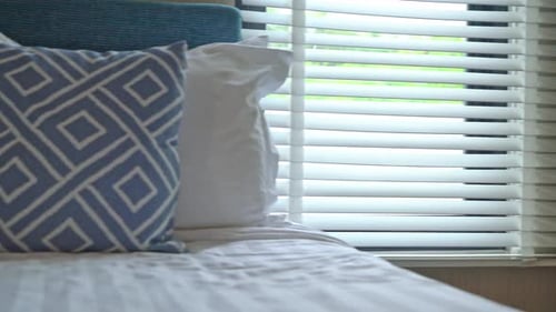 Close Up of Bed with Pillows and Window