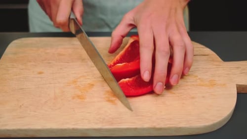 Dicing Red Pepper on a Wooden Cutting Board