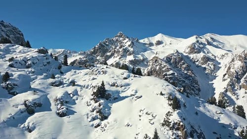 Aerial view, remote Winter wonderland, glacial mountainous environment
