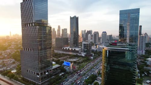 Panoramic cityscape of Indonesia capital city Jakarta at sunset.