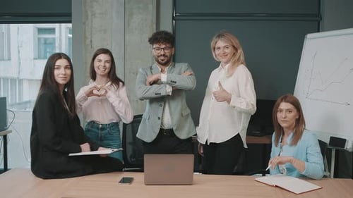 Team members collaborate in a modern office while reviewing important business documents