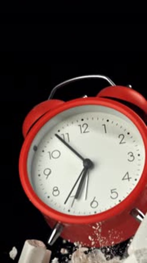 Alarm Clock and School Crayons Fly Up on a Black Background Filmed on a Highspeed Camera at 1000 Fps