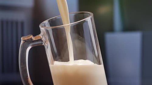 Milk is being poured into a glass