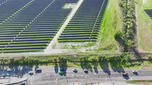 Aerial View of Large Sustainable Electrical Power Plant with Rows of Solar Photovoltaic Panels for