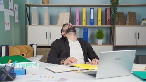 Office worker is tired and sleeping.