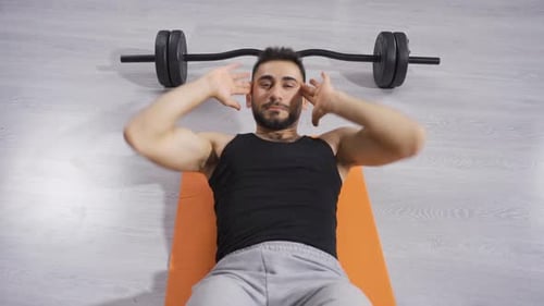 Man Doing Crunches in Home Gym