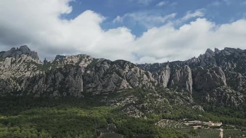Montserrat mountain aerial drone view flying sideways over the rocky peaks