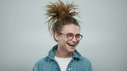 Portrait Happy Man Posing on Grey Background. Closeup Handsome Guy Laughing Camera