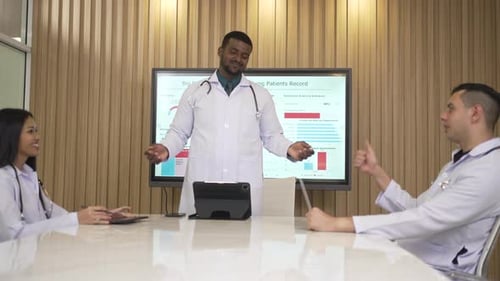 Medical Team Meeting With Data Presentation