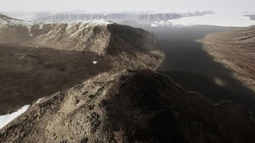 Beautiful Landscape with Cold Sea and Snowy Mountains