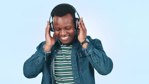 Dance, headphones and happy black man in studio for streaming song, radio and audio