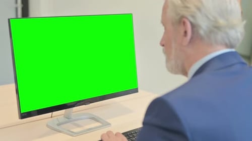 Senior Old Businessman Working on Computer with Green Screen