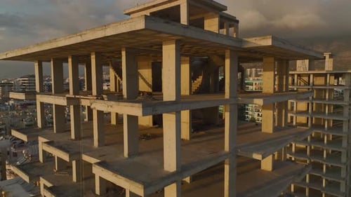 Aerial View The Frame of a Luxury Highrise Stands Tall Against the Sea Promising Exclusive Living By