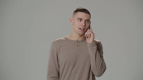 A Young Darkhaired Man is Discussing a Work Project with an Employer Specifying the Deadlines Studio