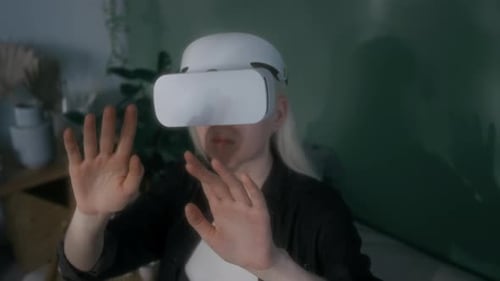 Woman Experiencing Virtual Reality in Her Home