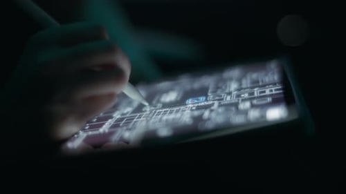 Tablet Showing Futuristic Building Blueprint with Stylus