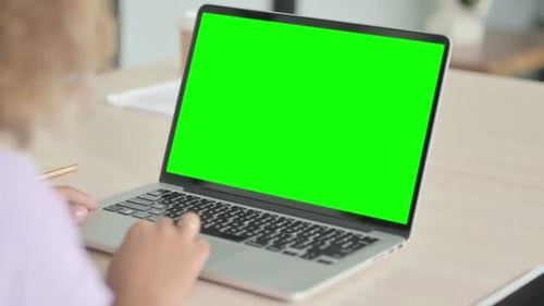 Close Up of African Woman Using Laptop with Green Screen