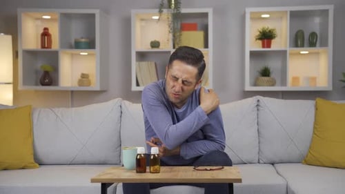 Man on Sofa Feeling Sick with the Flu