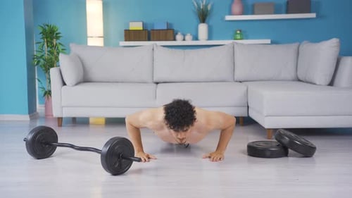 Muscular Man Does Push Ups at Home