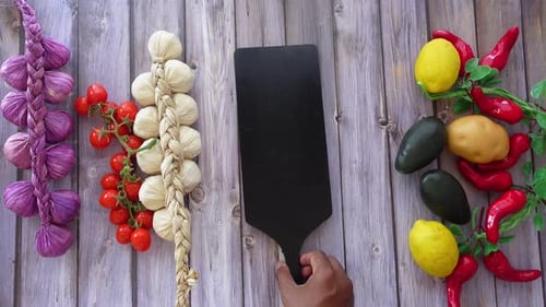 Vegetables and Fruits on Wooden Table with Cutting Board