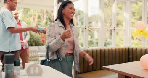 Friends Arrive for Birthday Celebration with Gifts