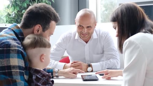 A Real Estate Agent and a Client Sign a Contract for the Purchase of a House on Credit