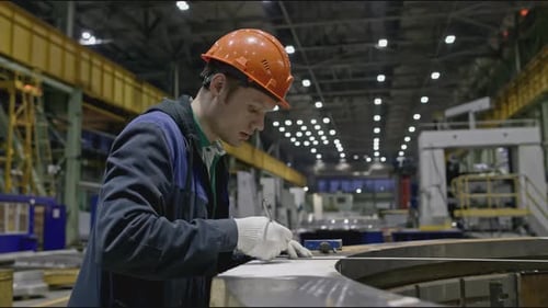 Worker Measures Structural Part at Factory Stock Clip Worker in Helmet at Factory Makes Measurements