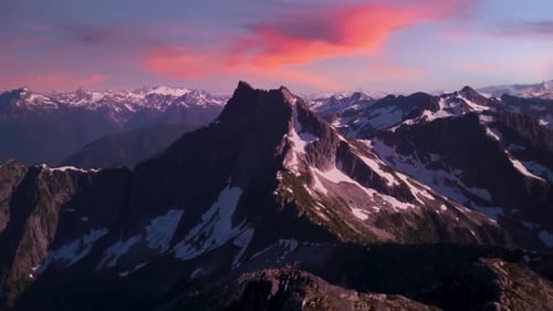Dramatic Rocky Peak and Mountain Landscape Snow Colorful Sunset Sky Late Winter Early Spring