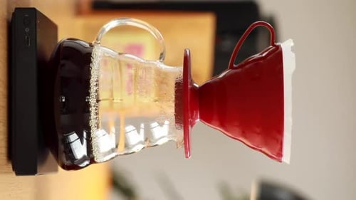 Pour Over Coffee Brews in Glass Filter