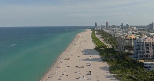 Miami Skyline Entering Harbor and Miami Beach City on Sunny Day USA Aerial View Miami Skyline