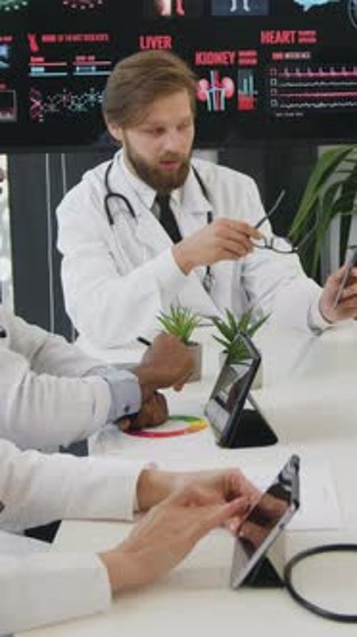 Medical Professionals Discussing X-Ray in Office Environment