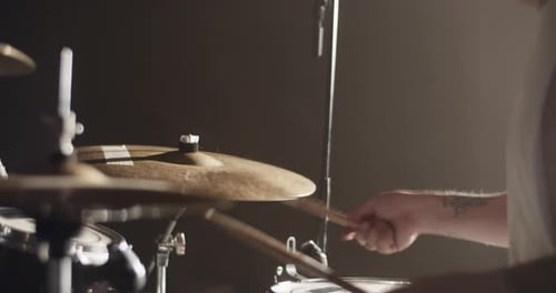 Man with Drum Kit Playing Music During Live Show