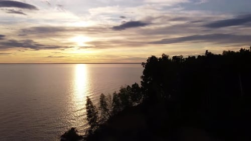 Sunset Over Tranquil Waters Aerial View