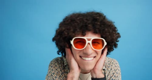 Fashion, sunglasses and face of man in studio dance for confidence, trendy style and accessories