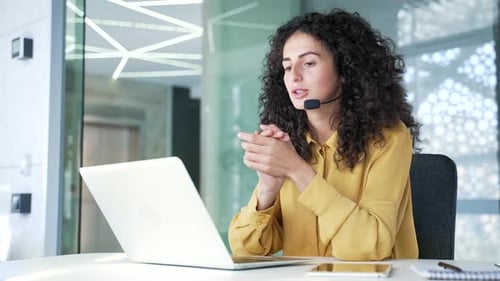 Business Woman Video Conference in Bright Office