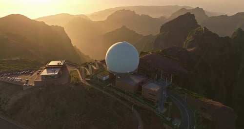Aerial View of Dome Structure on Mountain at Sunset