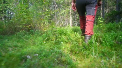 man hiking through the woods