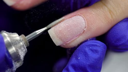 Electric File Prepares Fingernail for Manicure