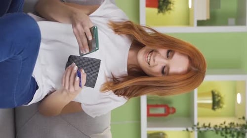 Vertical Video of Smiling cheerful young woman holding shopping bags purchased.
