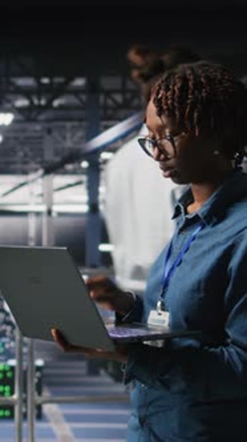 Vertical Video System Administrators on Data Center Platform Analyzing Performance Outputs